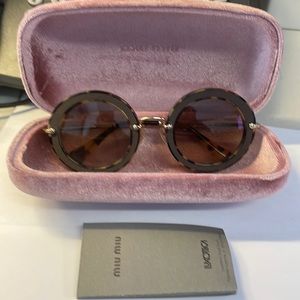 Authentic Miu Miu sunglasses with case  no scratches